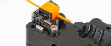 disassembled 3d printer exruder showcasing filament sensor